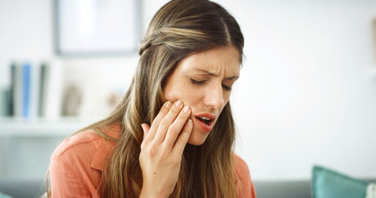 Woman, pain and infection with tooth ache for dental issue, oral or gum disease at home